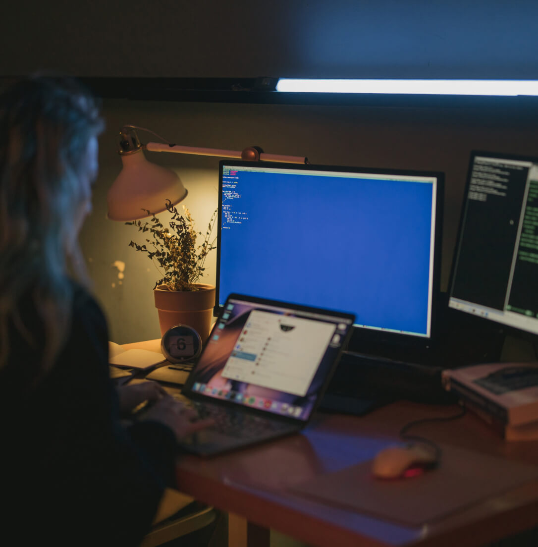 Woman at computer logging into SureDrop